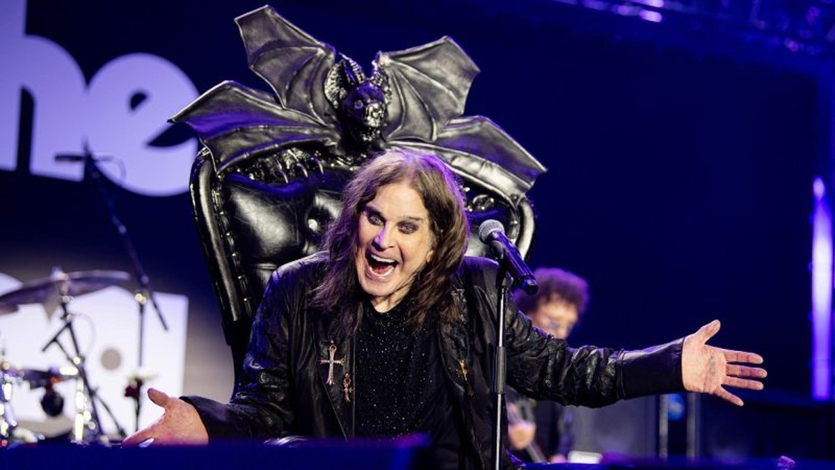 Ozzy Osbourne performs seated onstage at Back to the Beginning.